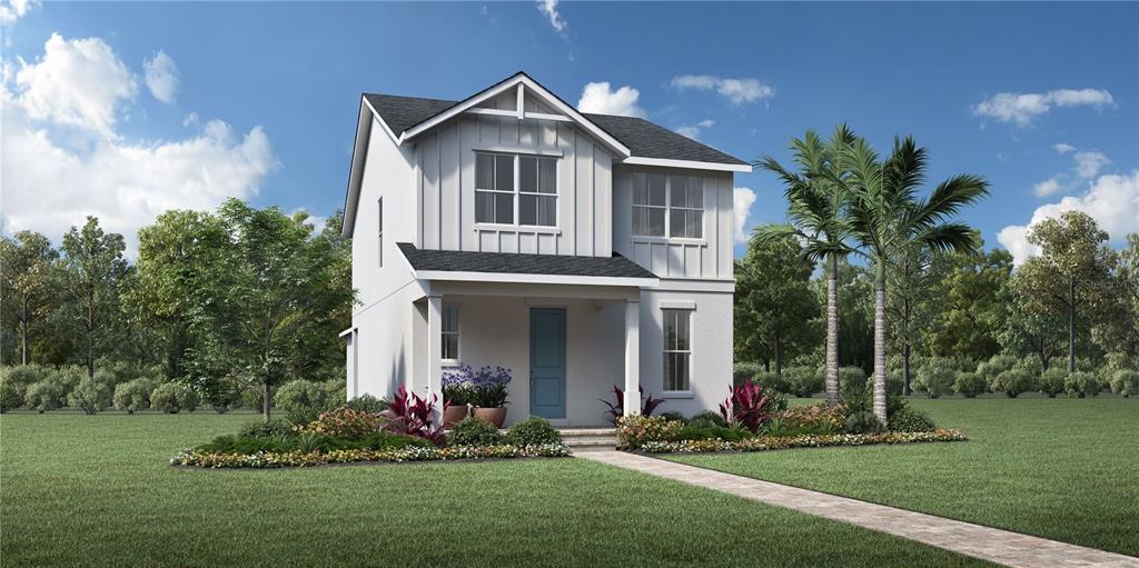 a front view of a house with a yard and potted plants