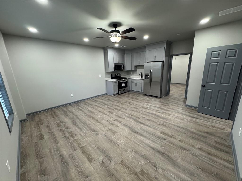 a view of a kitchen with a sink