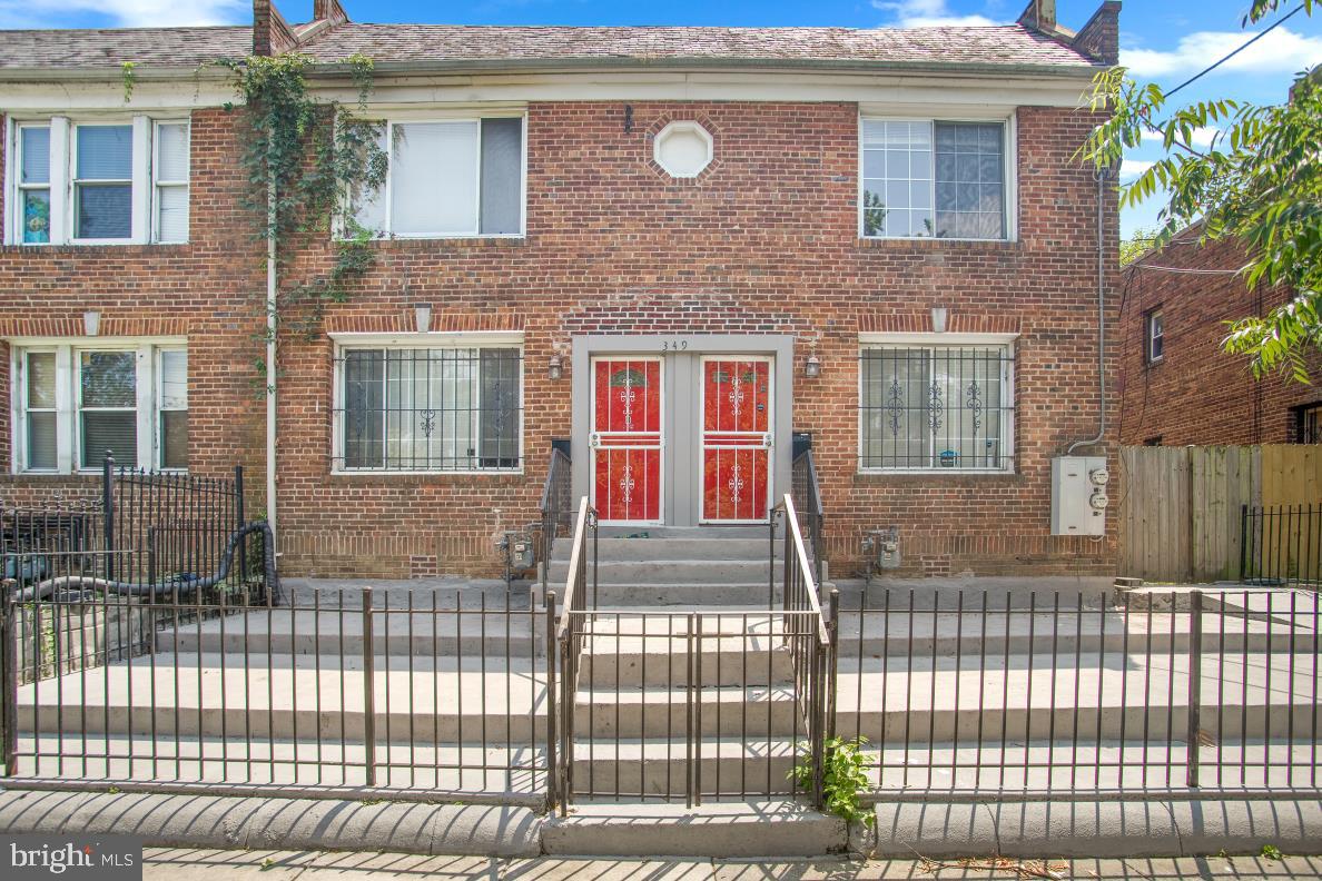 a front view of a house with glass windows