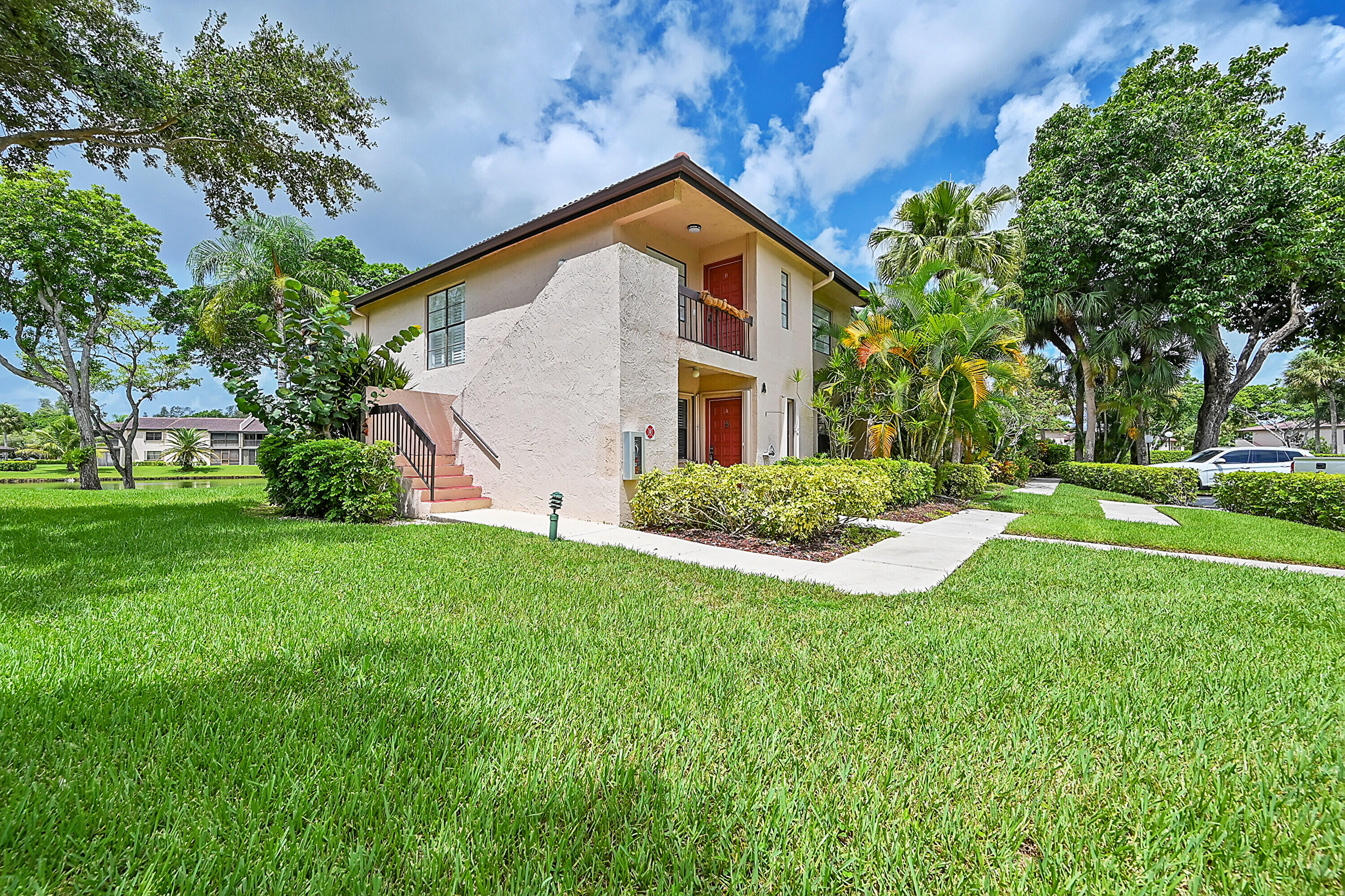 a front view of house with yard and green space