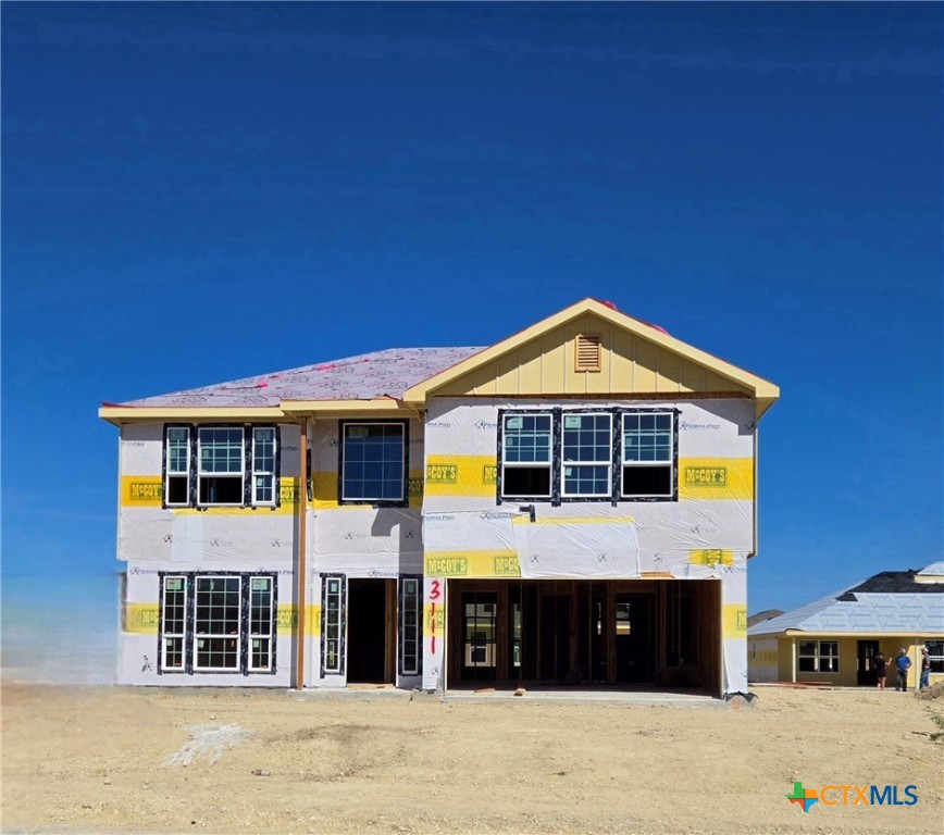 a front view of a house with yard