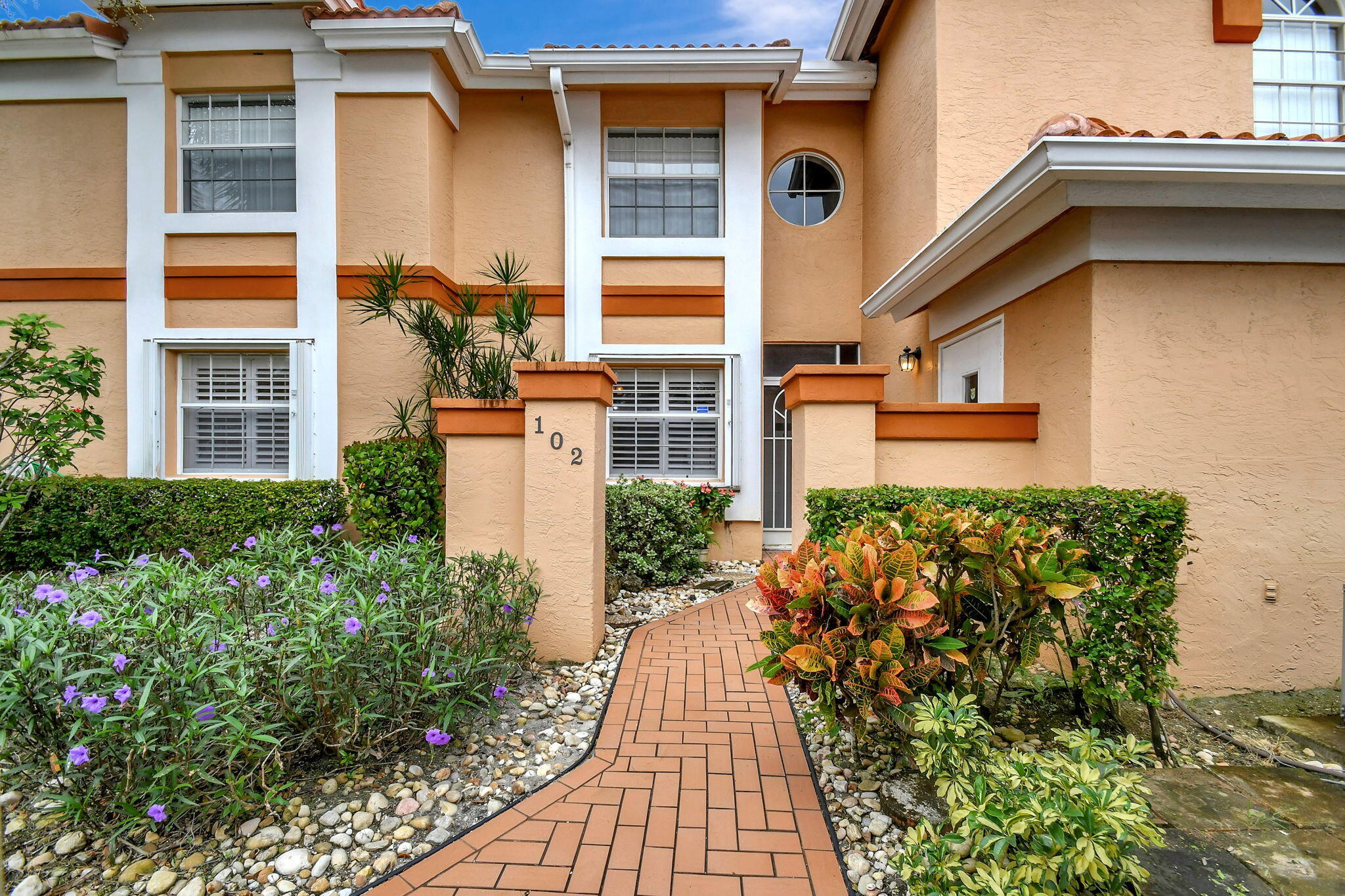 front view of a house with a yard