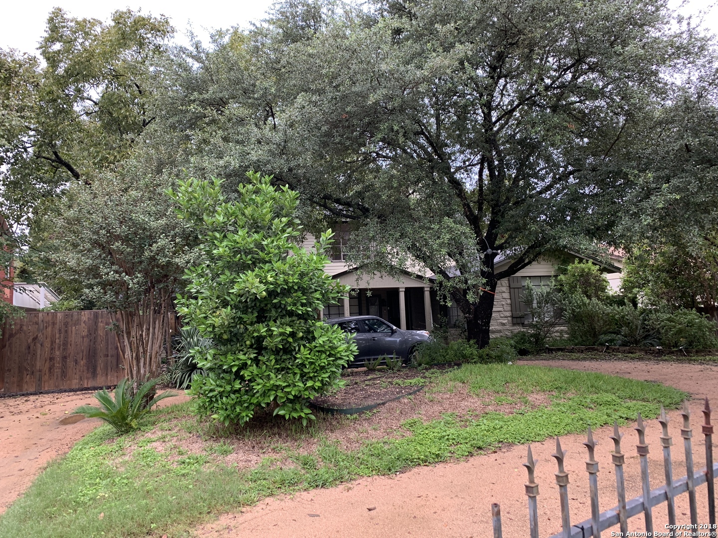 a view of house with a yard