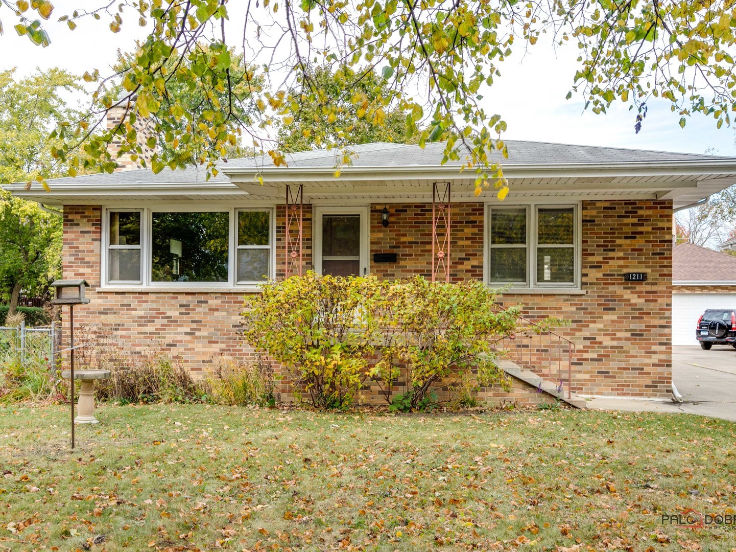 front view of a house with a yard