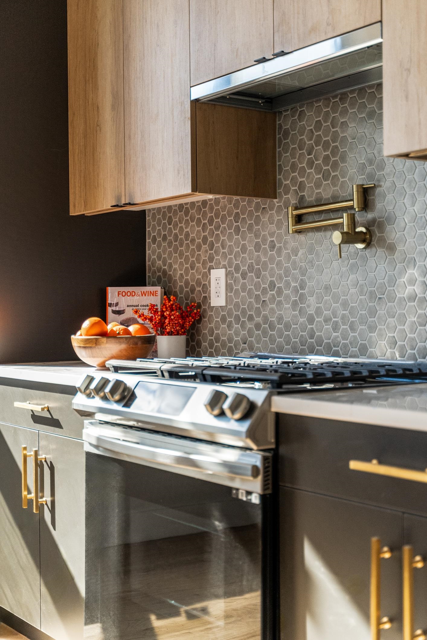 a stove top oven sitting inside of a kitchen