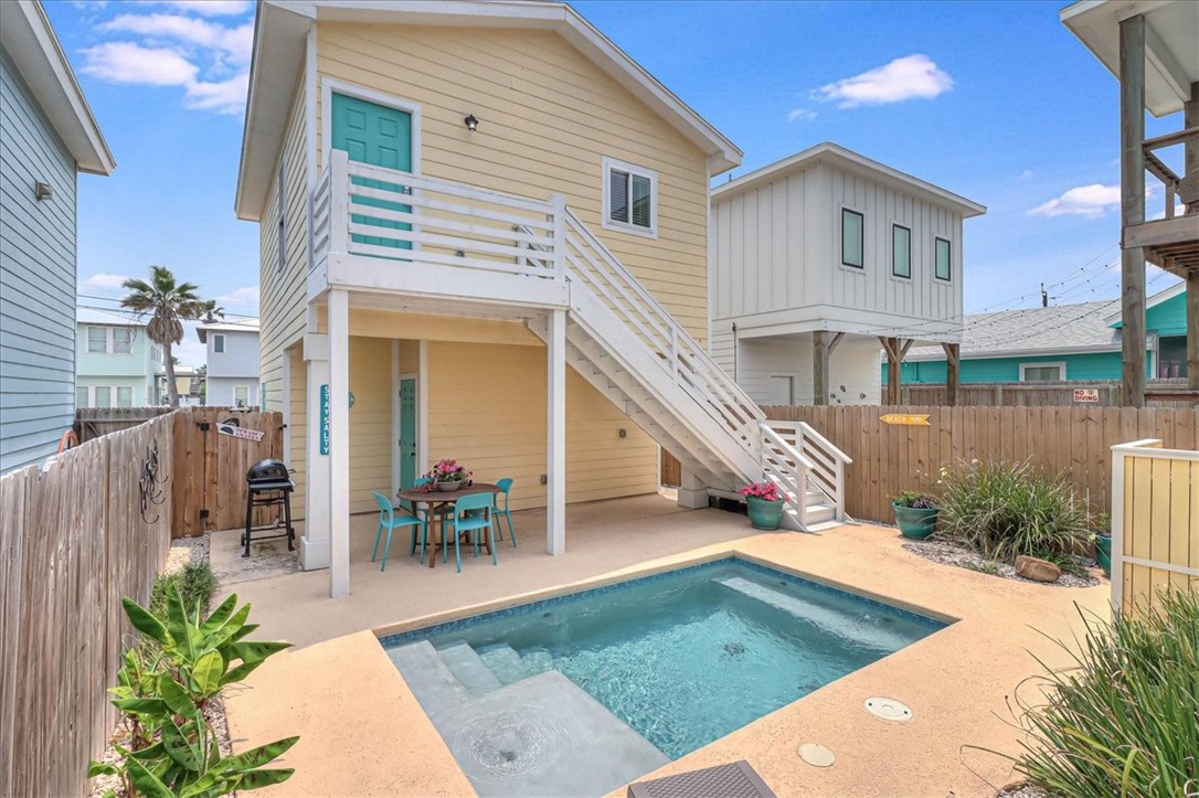 a view of a house with couches in patio