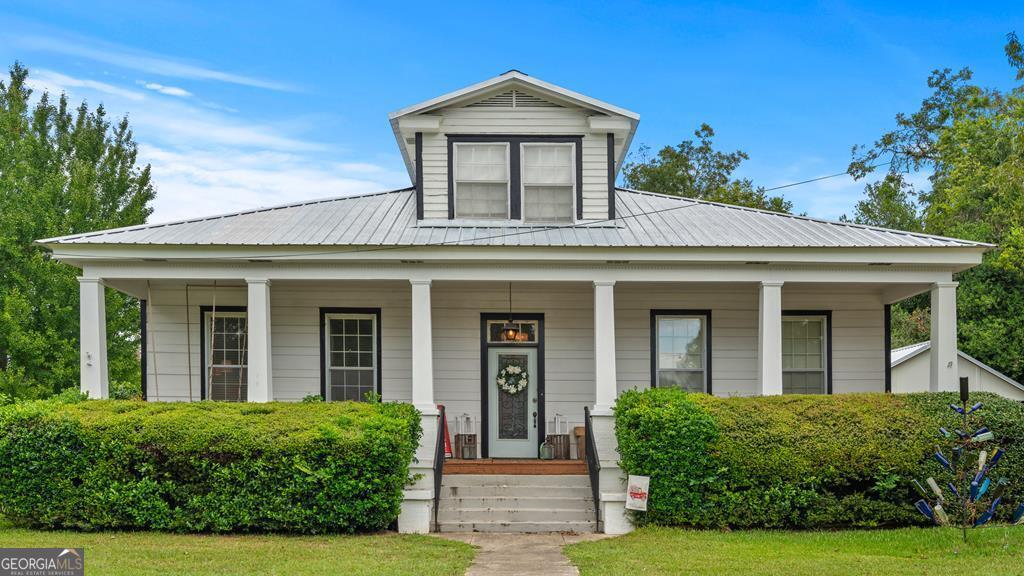 front view of a house with a yard