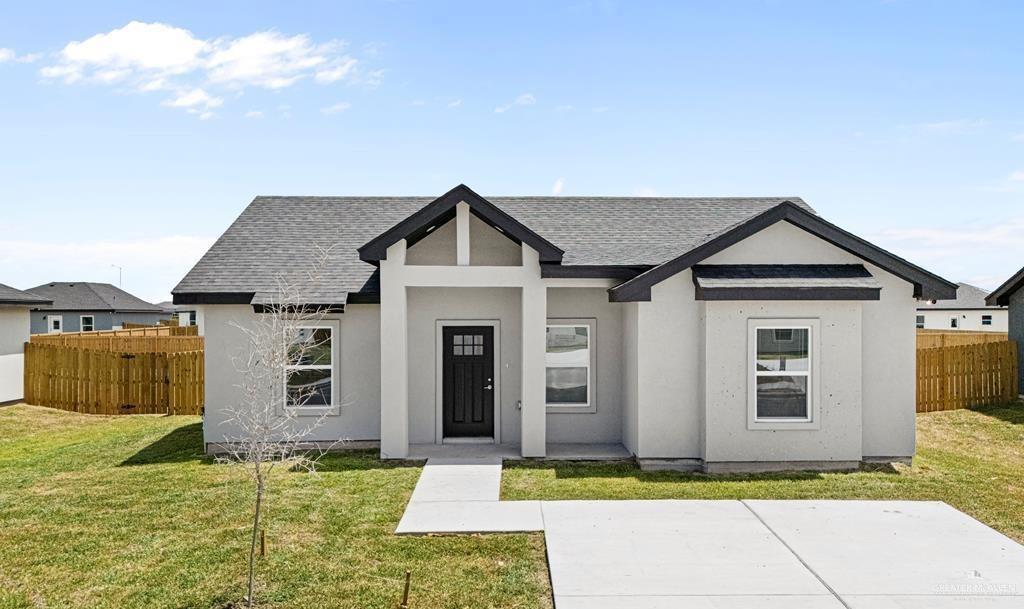 View of front of property featuring a front lawn