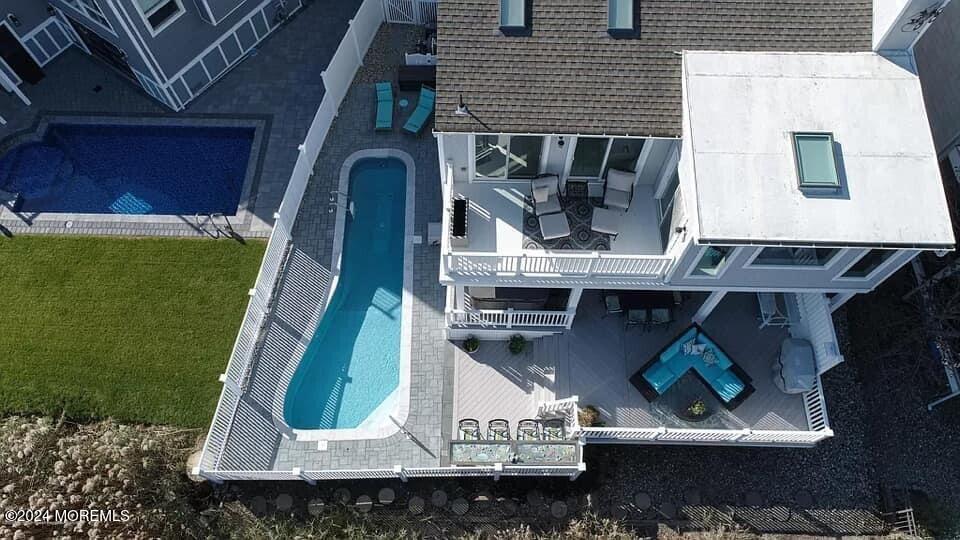 an aerial view of a house with a swimming pool