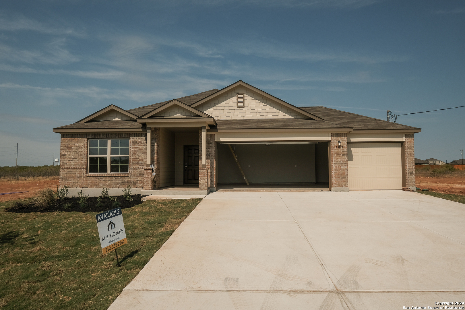 a front view of a house with yard