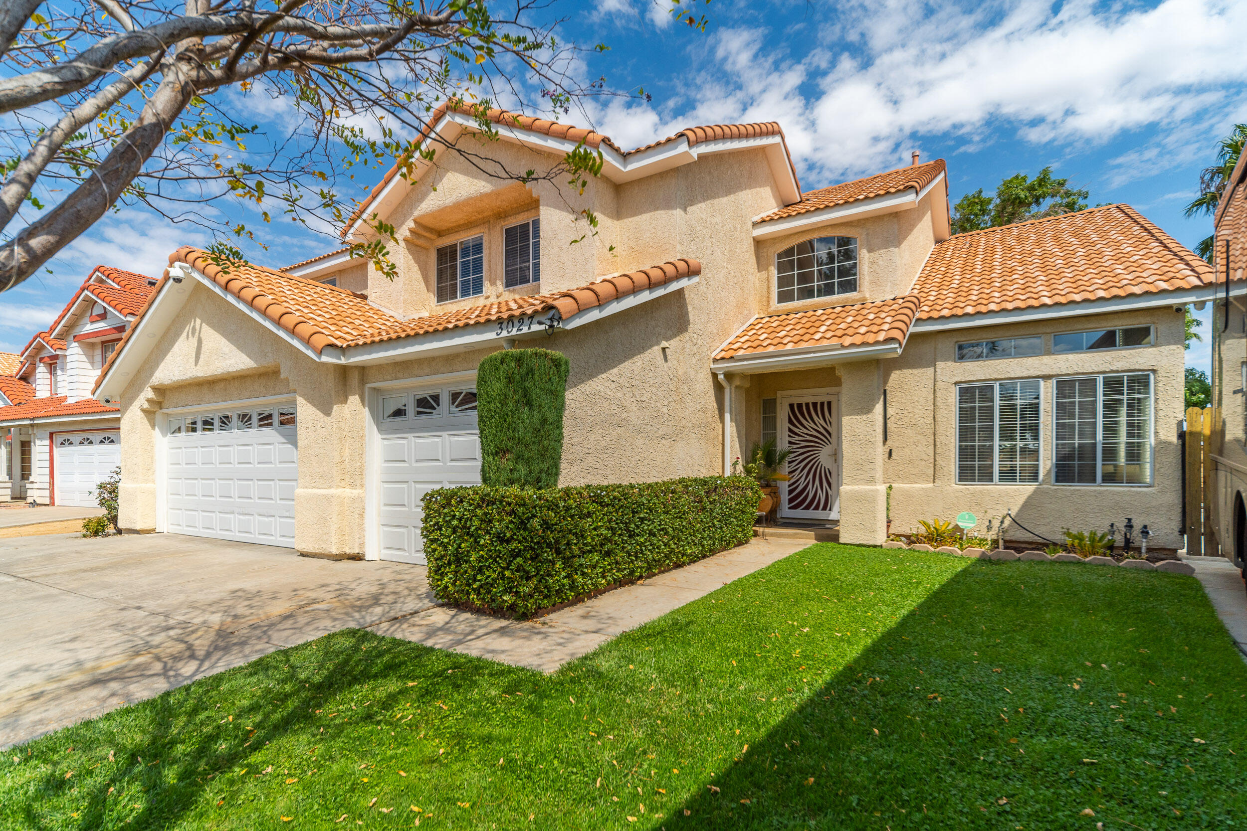 front view of a house with a yard