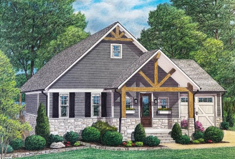 a front view of a house with a yard and potted plants