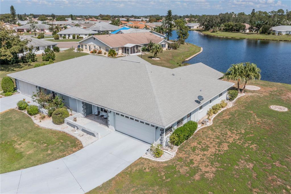 an aerial view of a house with a swimming pool and outdoor space