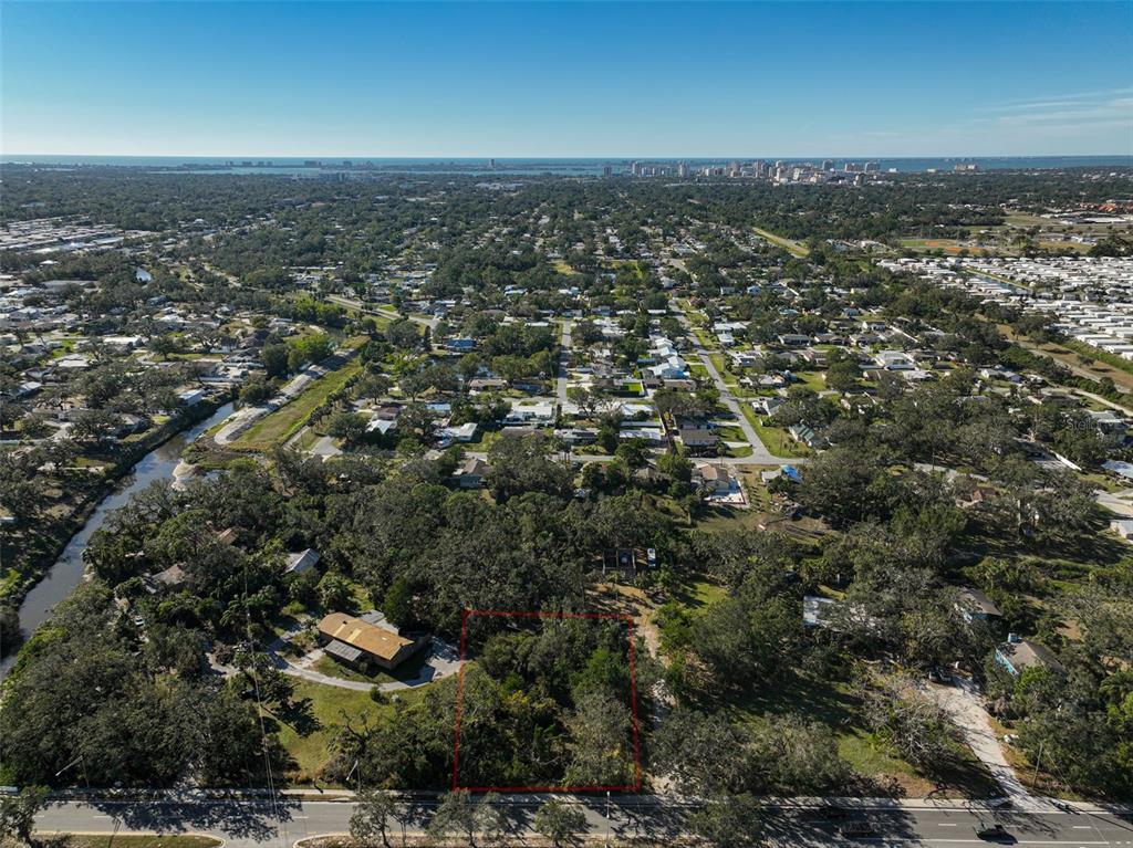 an aerial view of residential building with trees