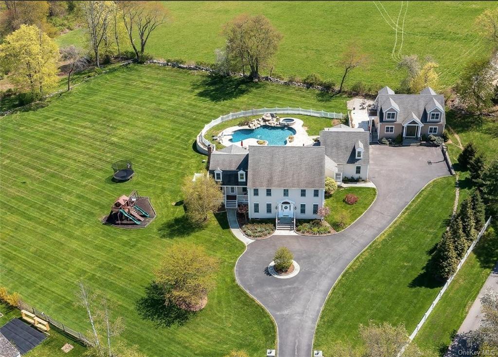 an aerial view of a house with outdoor space