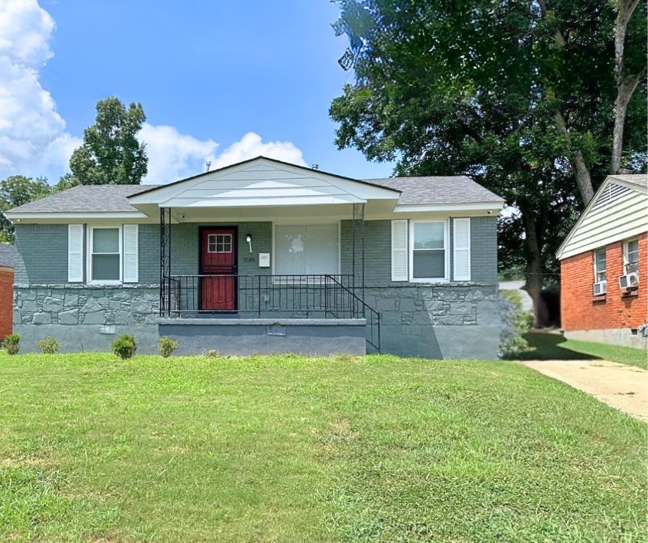 Bungalow-style home with a porch, cooling unit, and a front yard