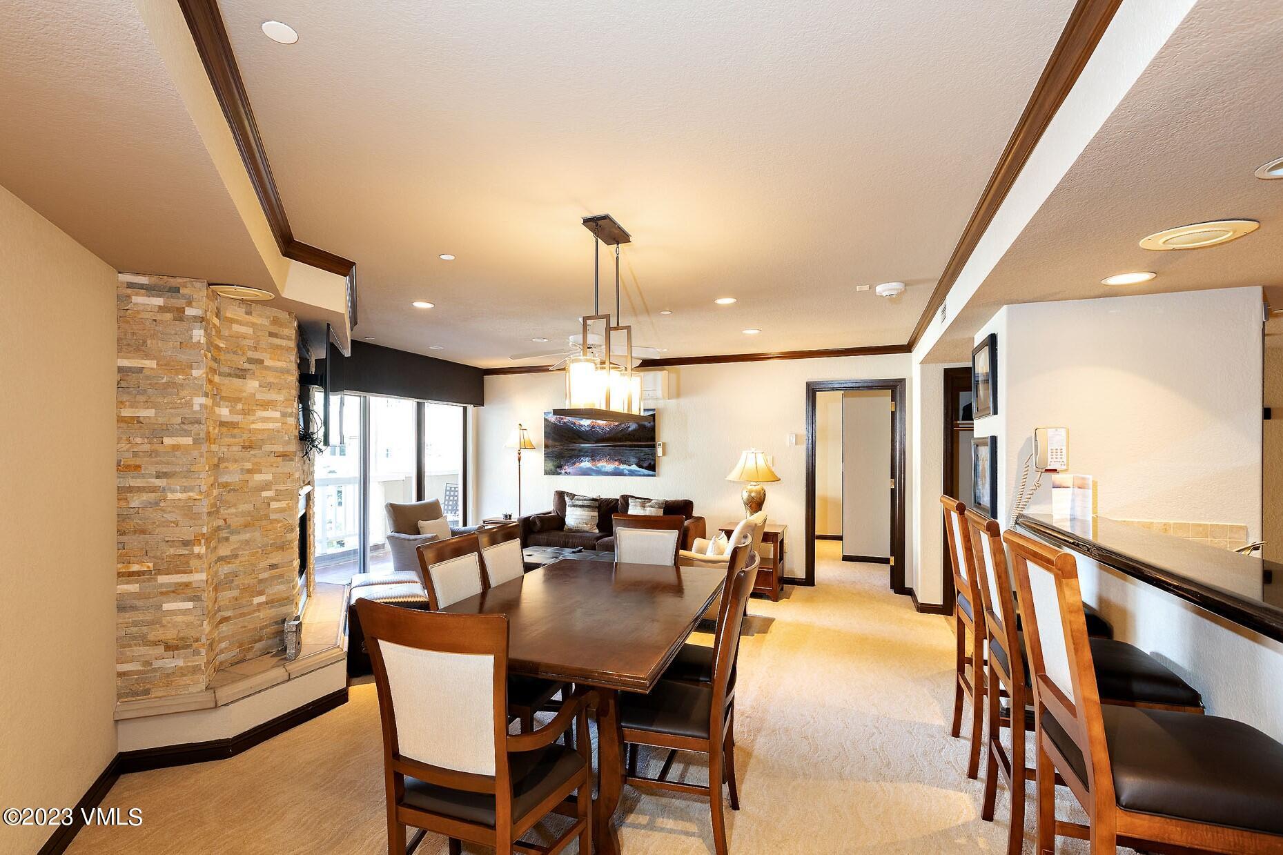 a view of a dining room with furniture and a window