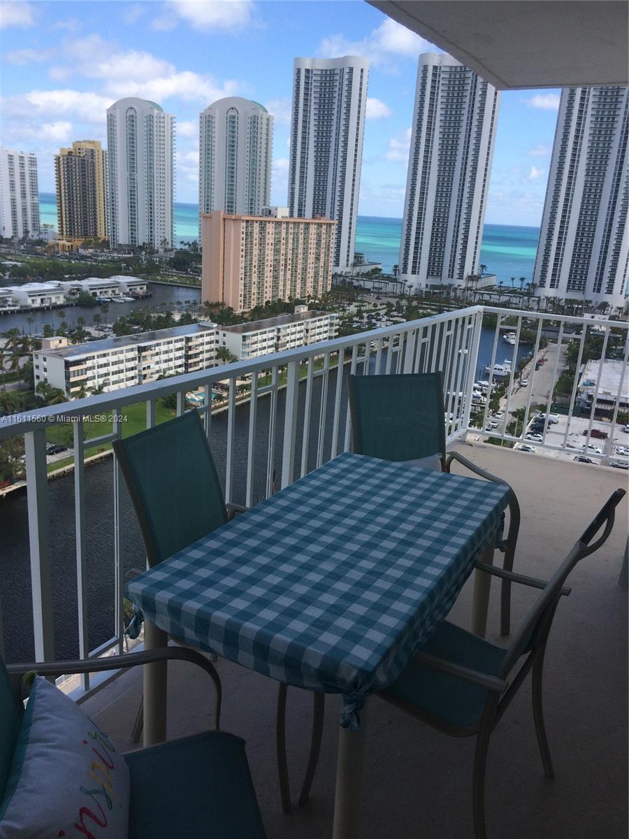 a view of a dinning table and chairs in patio