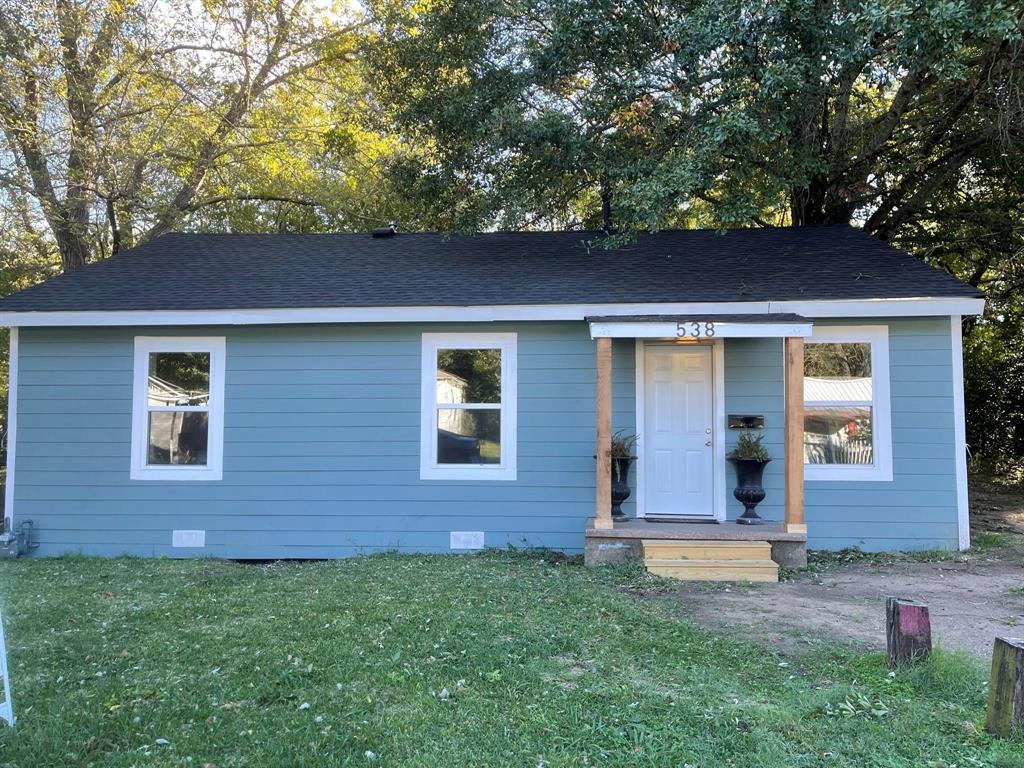 front view of house with a yard