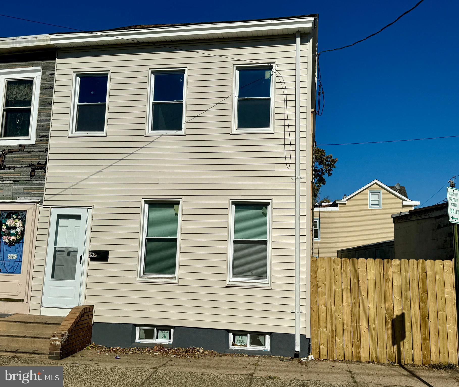 a view of a house with a door and a yard