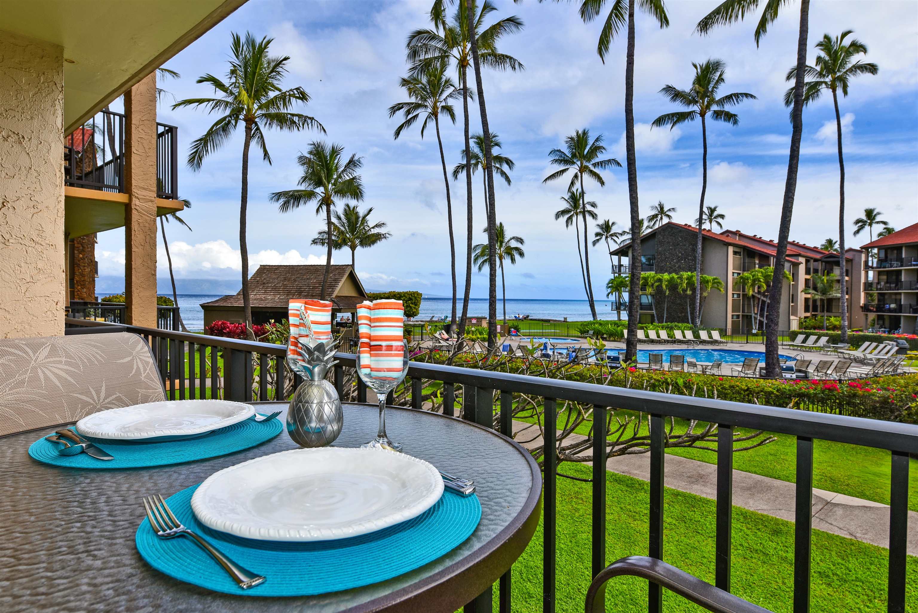 a view of a balcony with chairs and a table