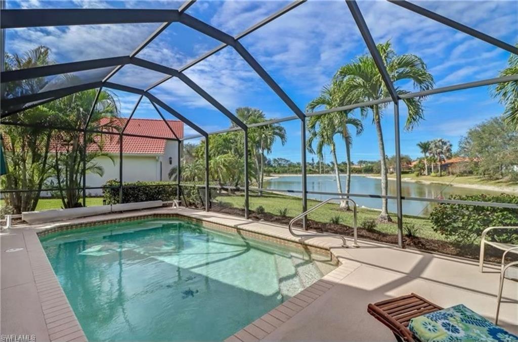 a swimming pool with outdoor seating and yard