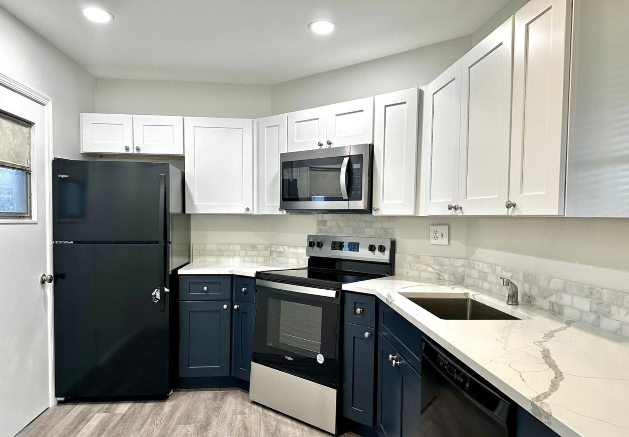 a kitchen with a sink a stove and refrigerator