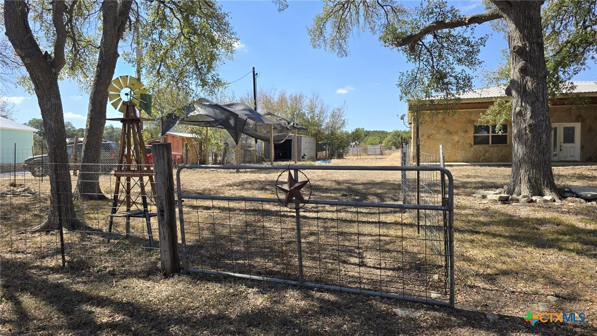 a view of a backyard of the house