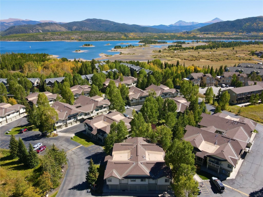 Aerial view with unit building in foreground and Lake Dillon in the background