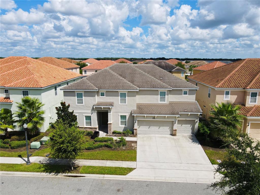 a aerial view of a house with a yard