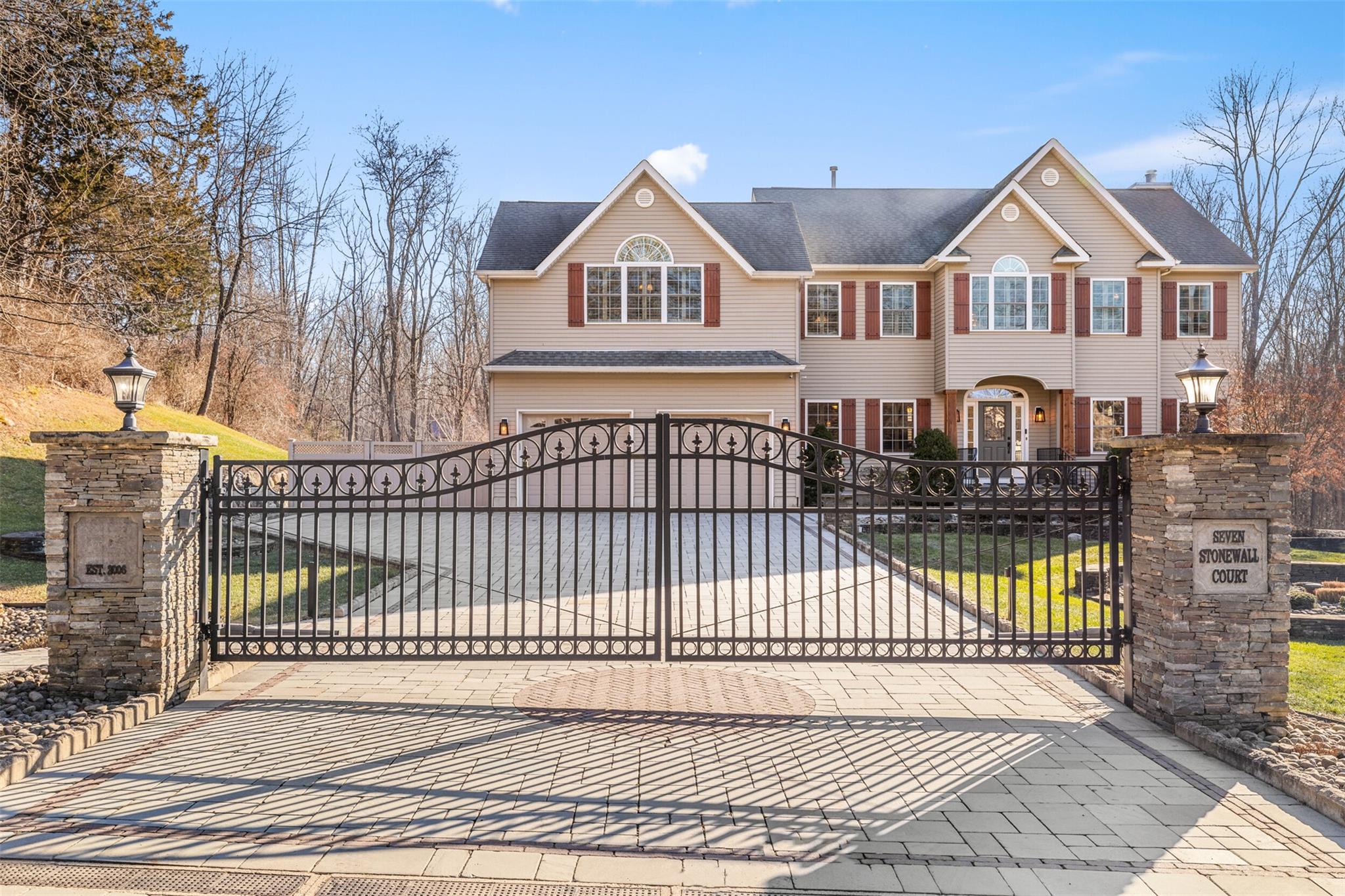 View of gate with a garage