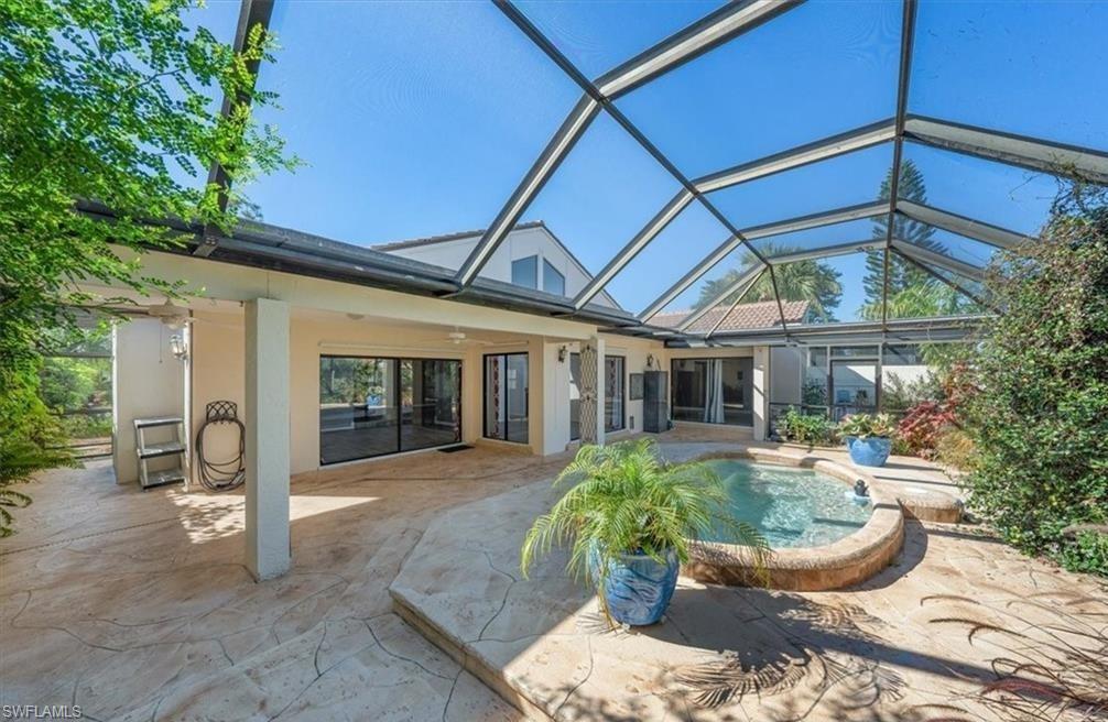 a house view with a seating space and garden