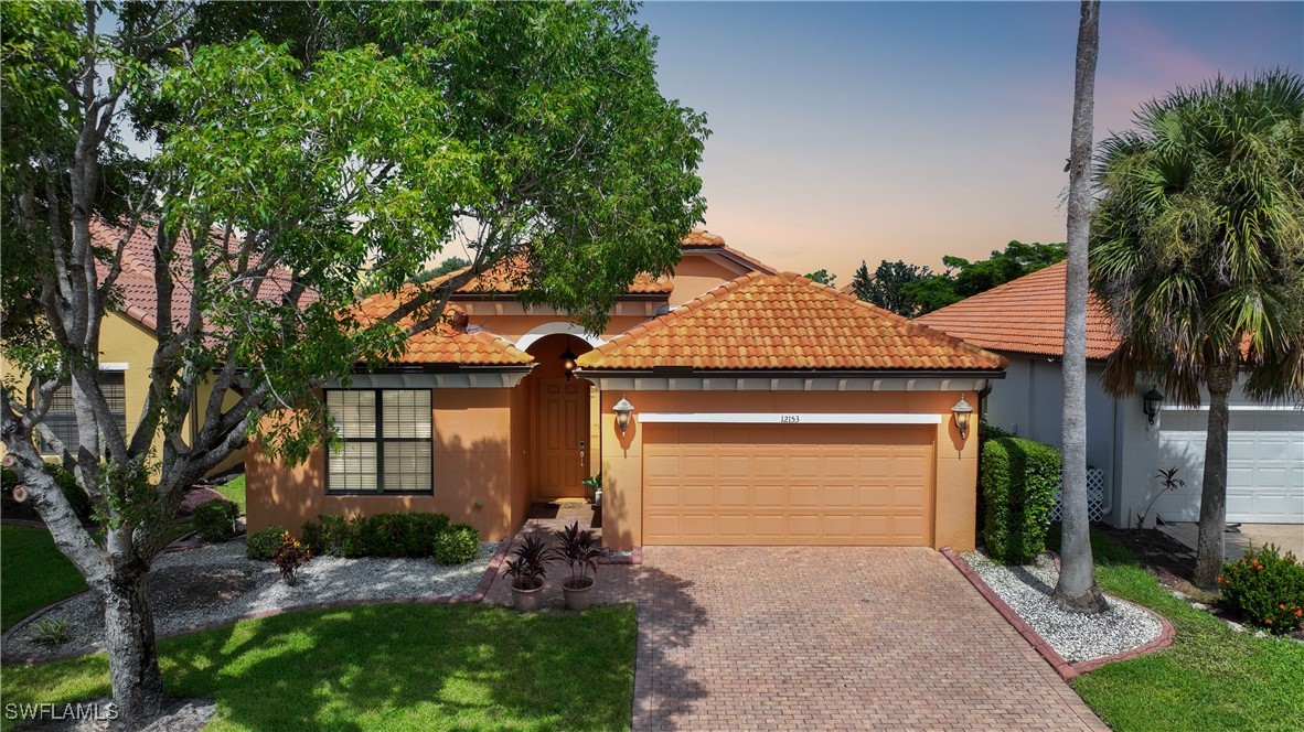 front view of a house with a yard