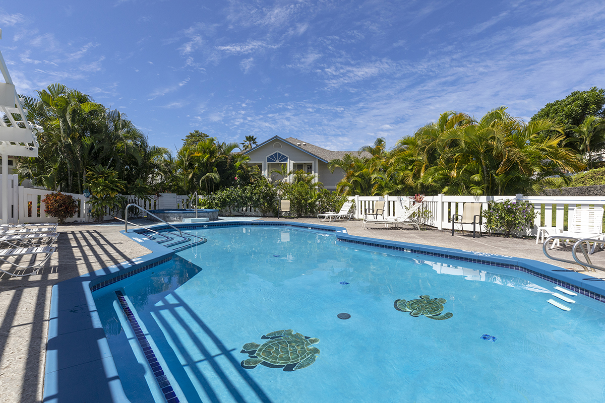 a view of swimming pool with seating space