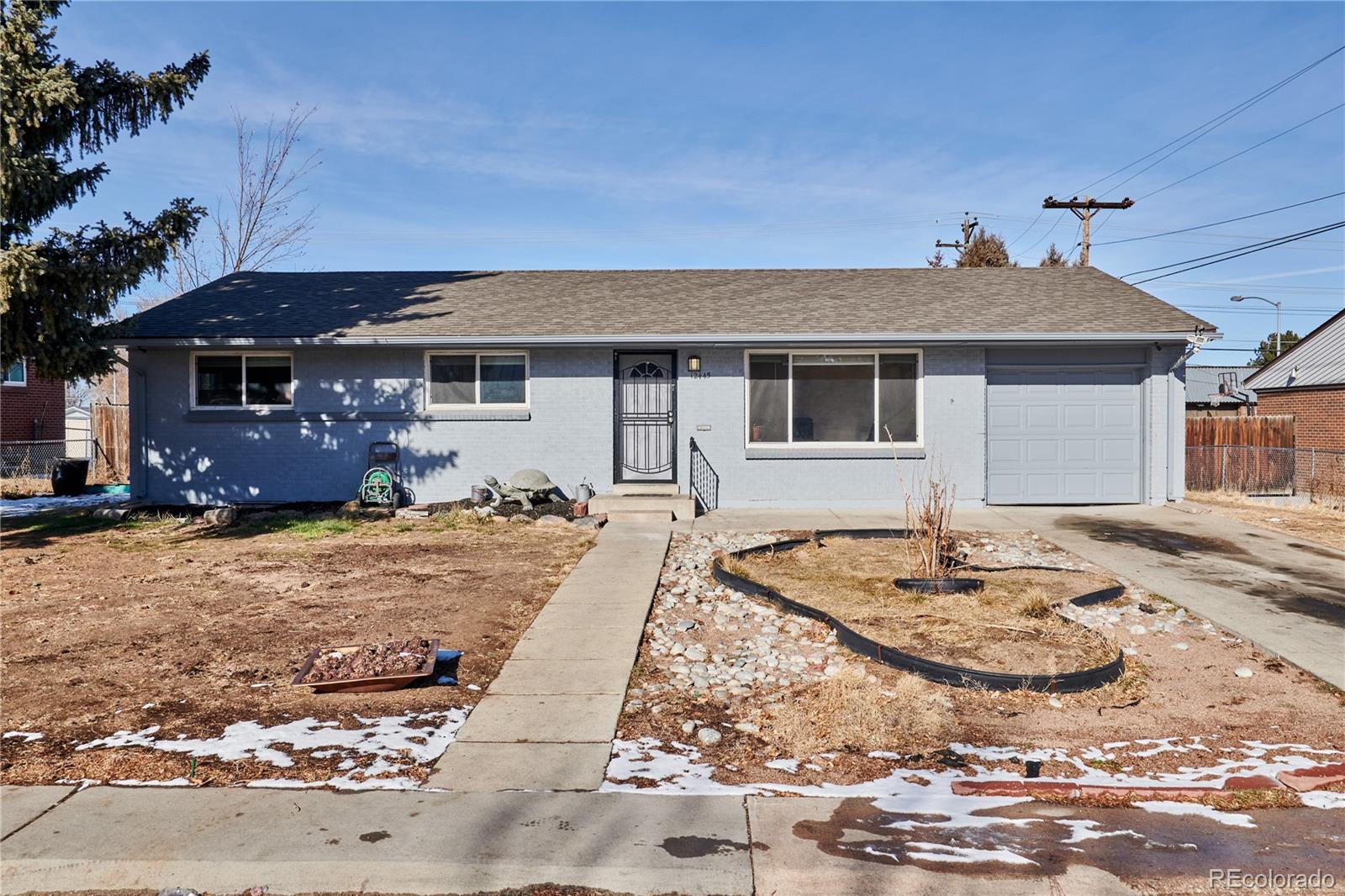 a front view of house with yard outdoor space and seating area