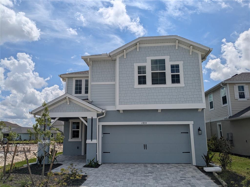 a front view of a house with a garage