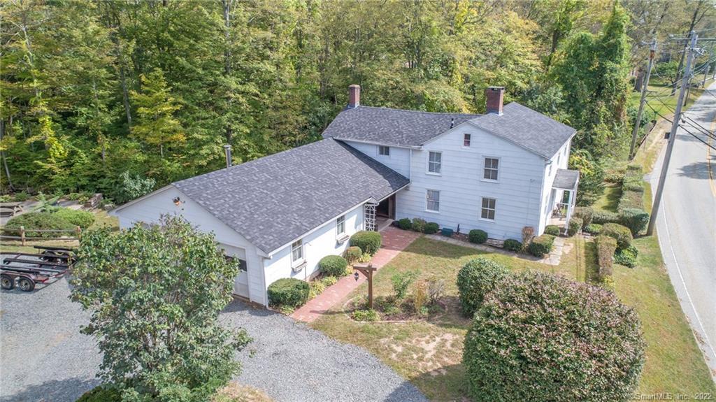 aerial view of a house with a yard