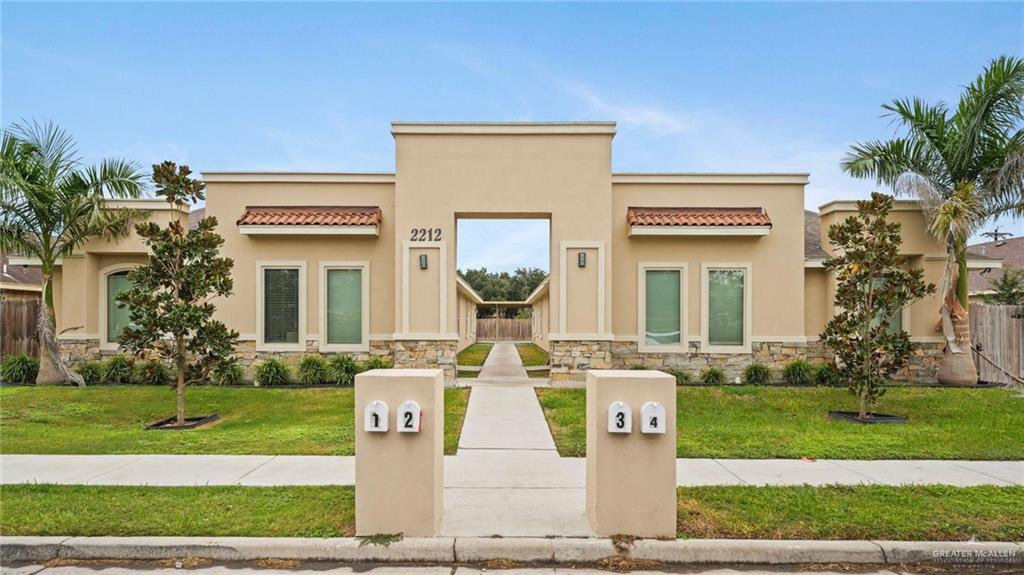 View of front of property with a front yard