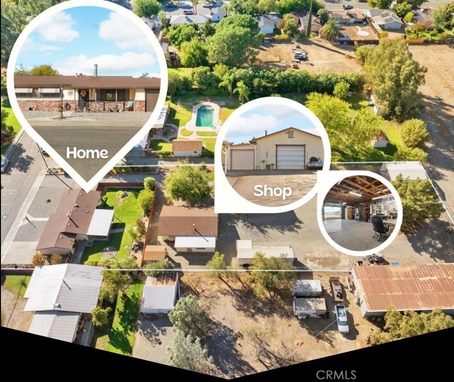 an aerial view of a house with swimming pool and a yard