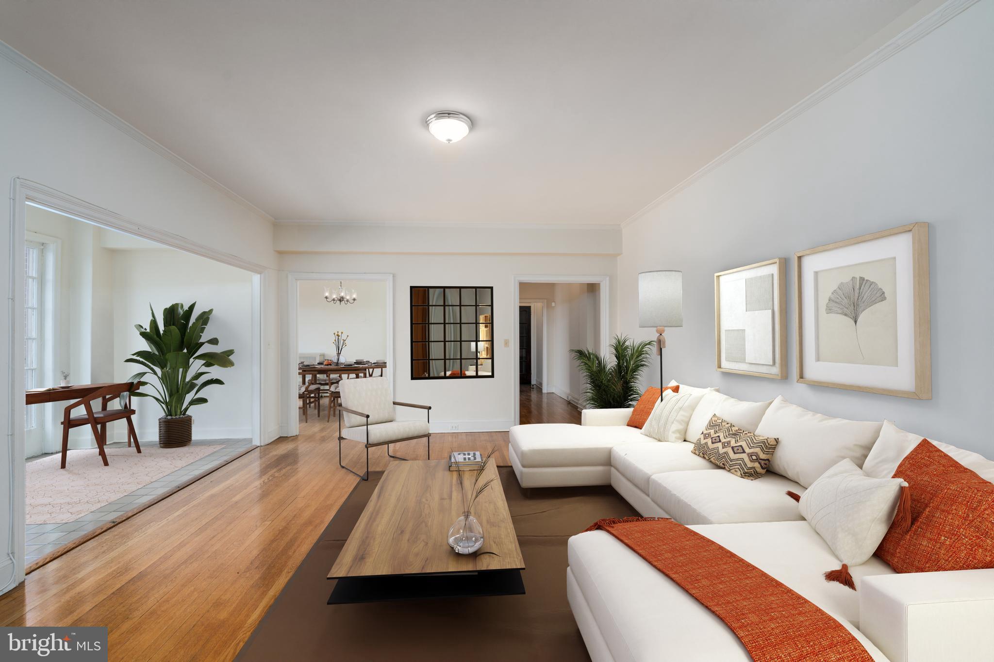 a living room with furniture and a table