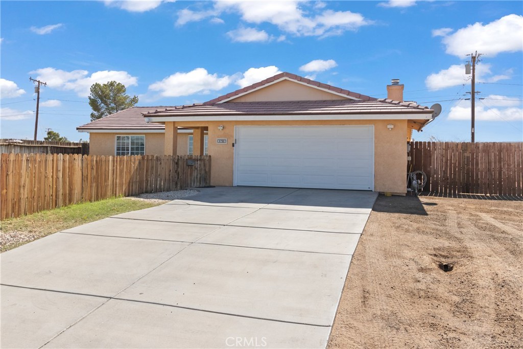 a front view of a house with a garage