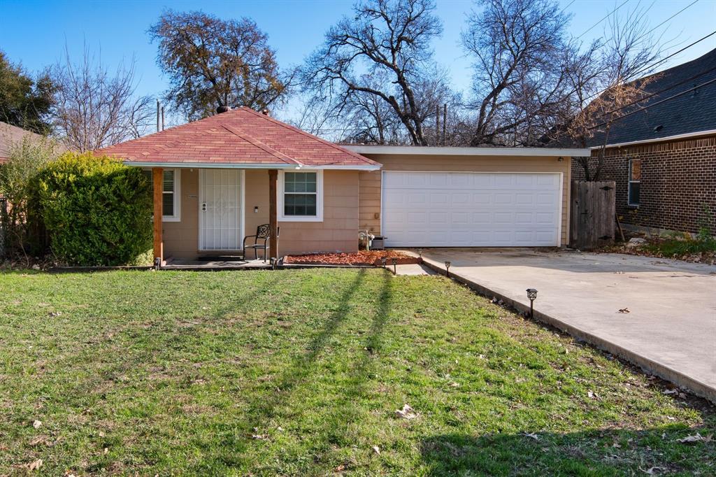 a backyard of a house with yard and outdoor seating