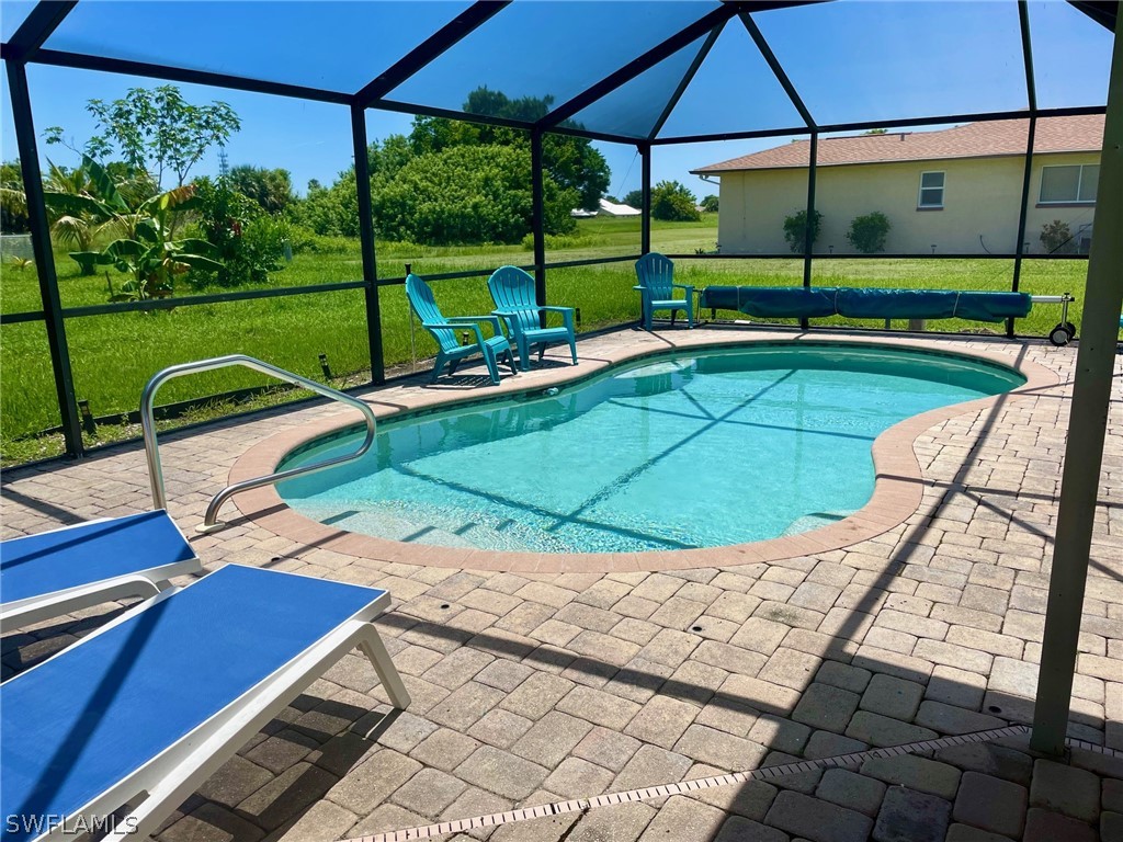 a view of a backyard with sitting area