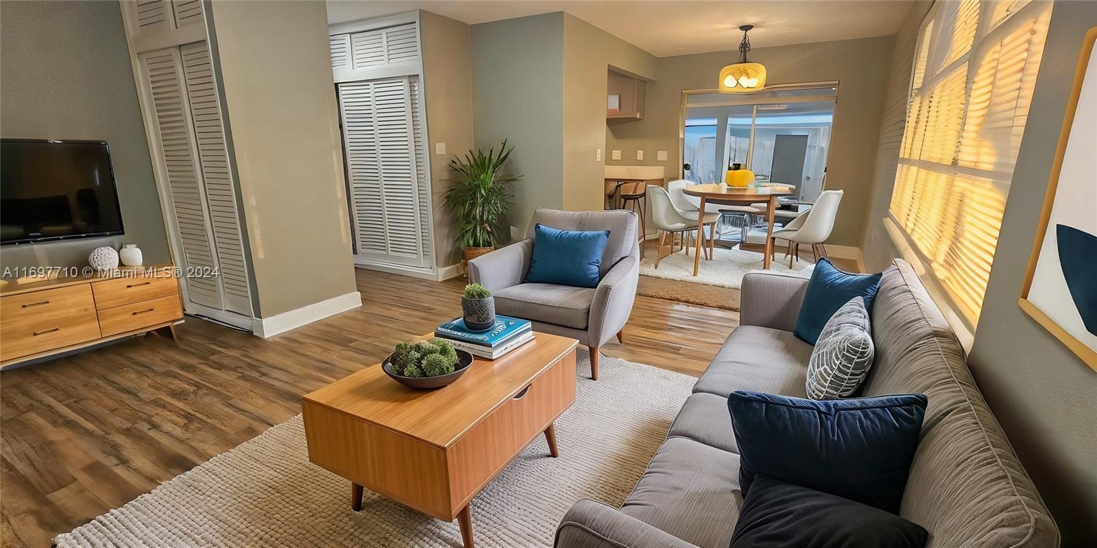 a living room with furniture and a flat screen tv