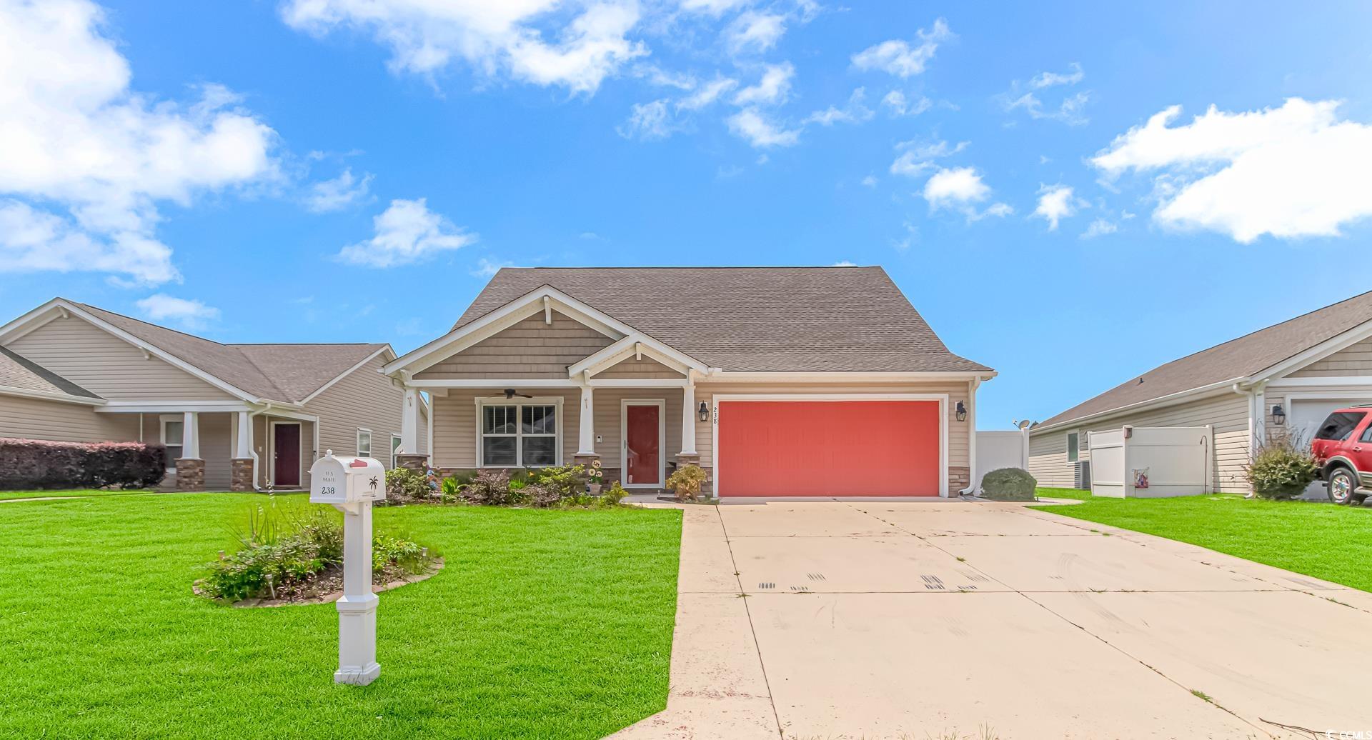 Craftsman-style house featuring a front yard and a