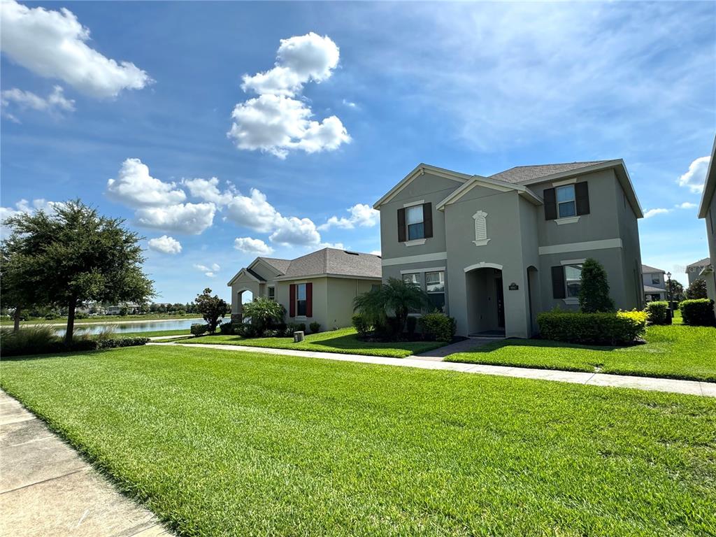 a front view of a house with a yard