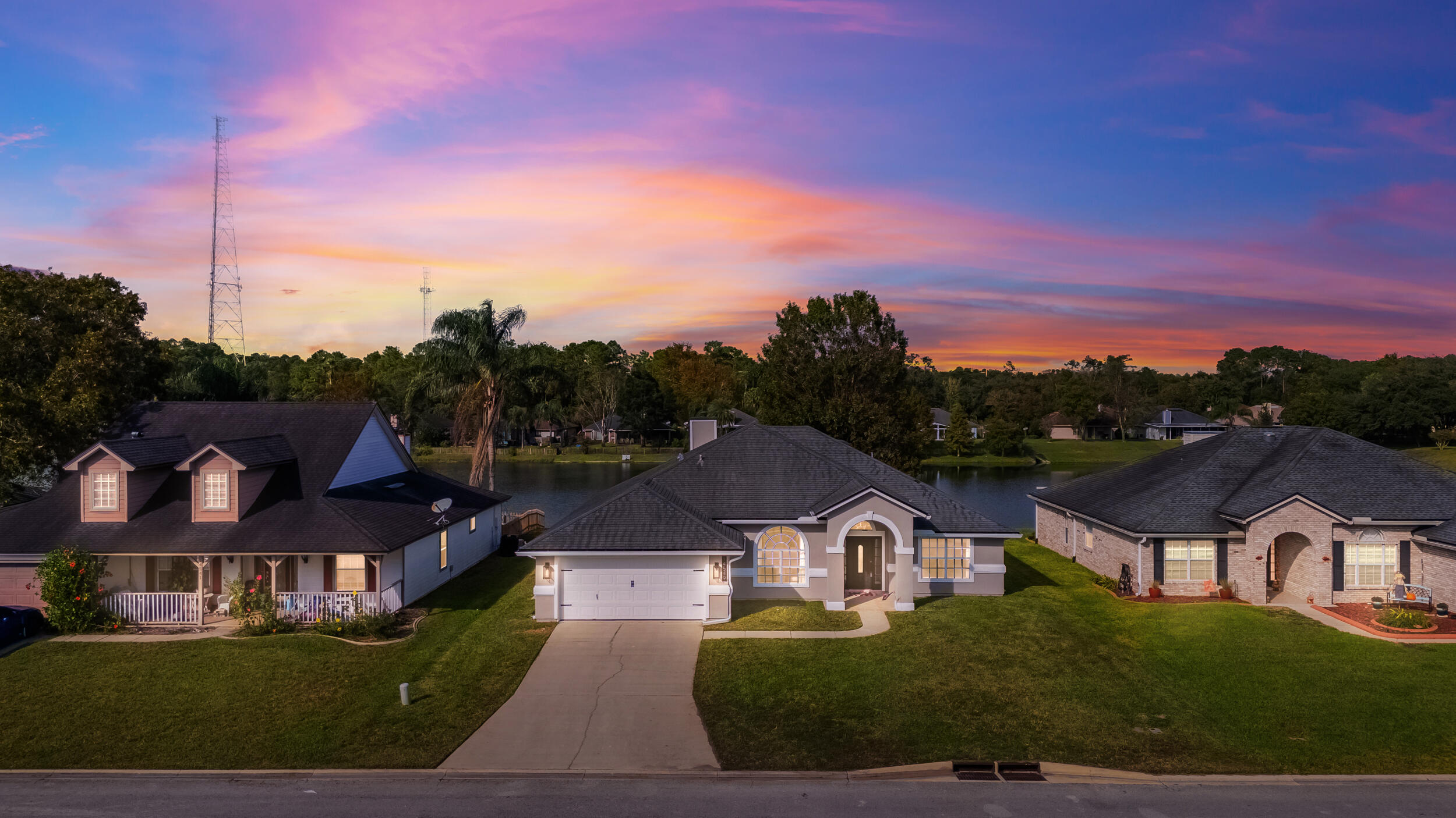 an aerial view of residential houses and city street