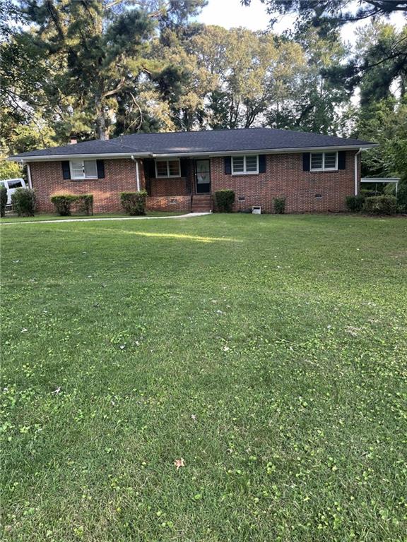 front view of a house with a yard