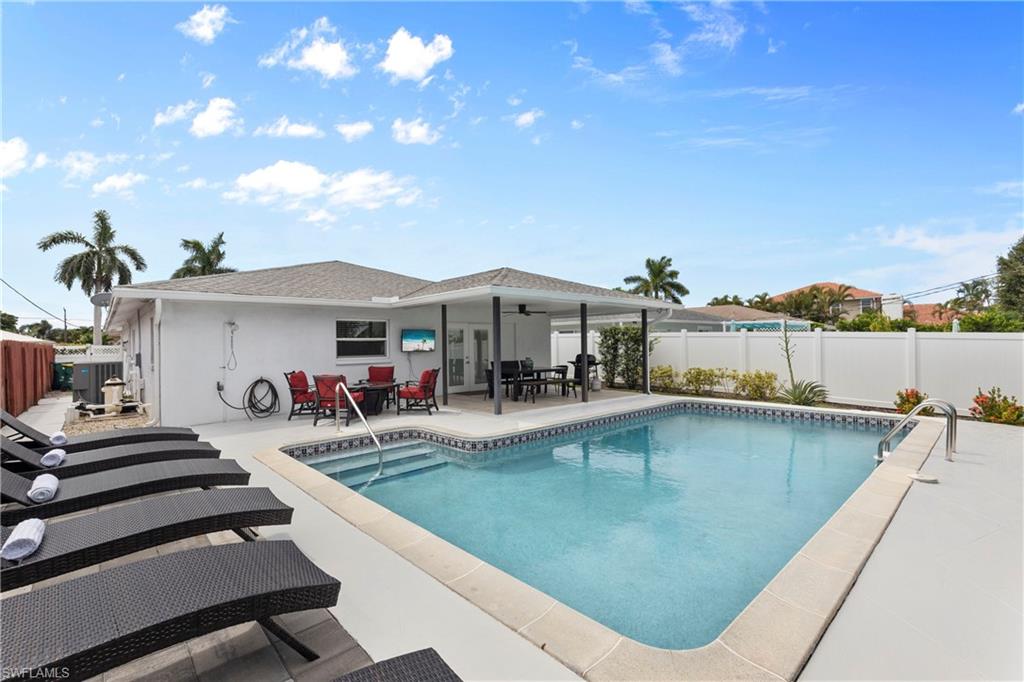 a view of a patio with swimming pool