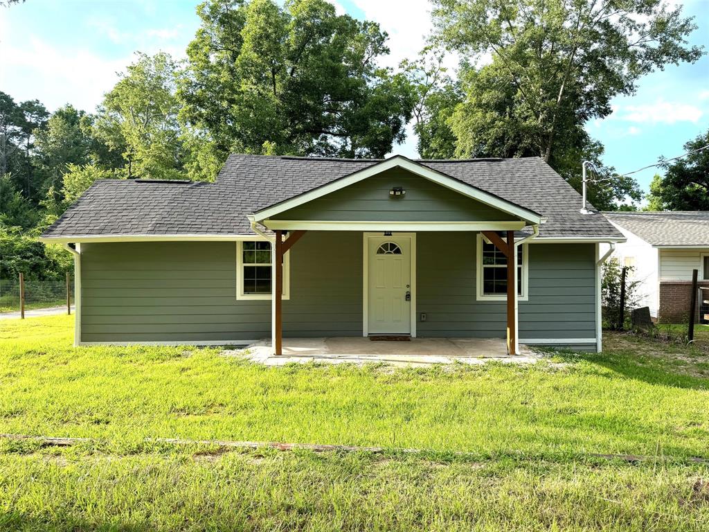 a house with trees in the background